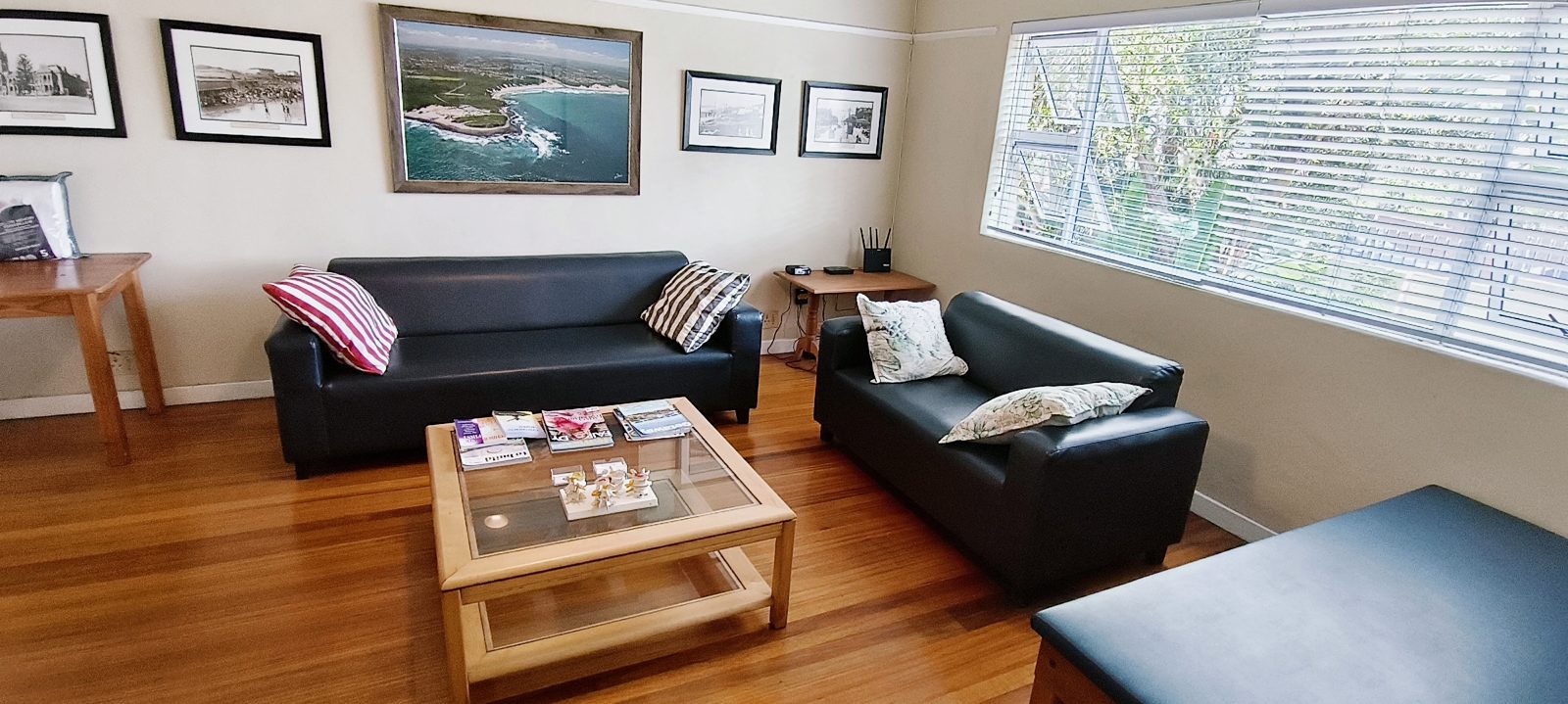 The reception and waiting room, with photographs of the East London coastline